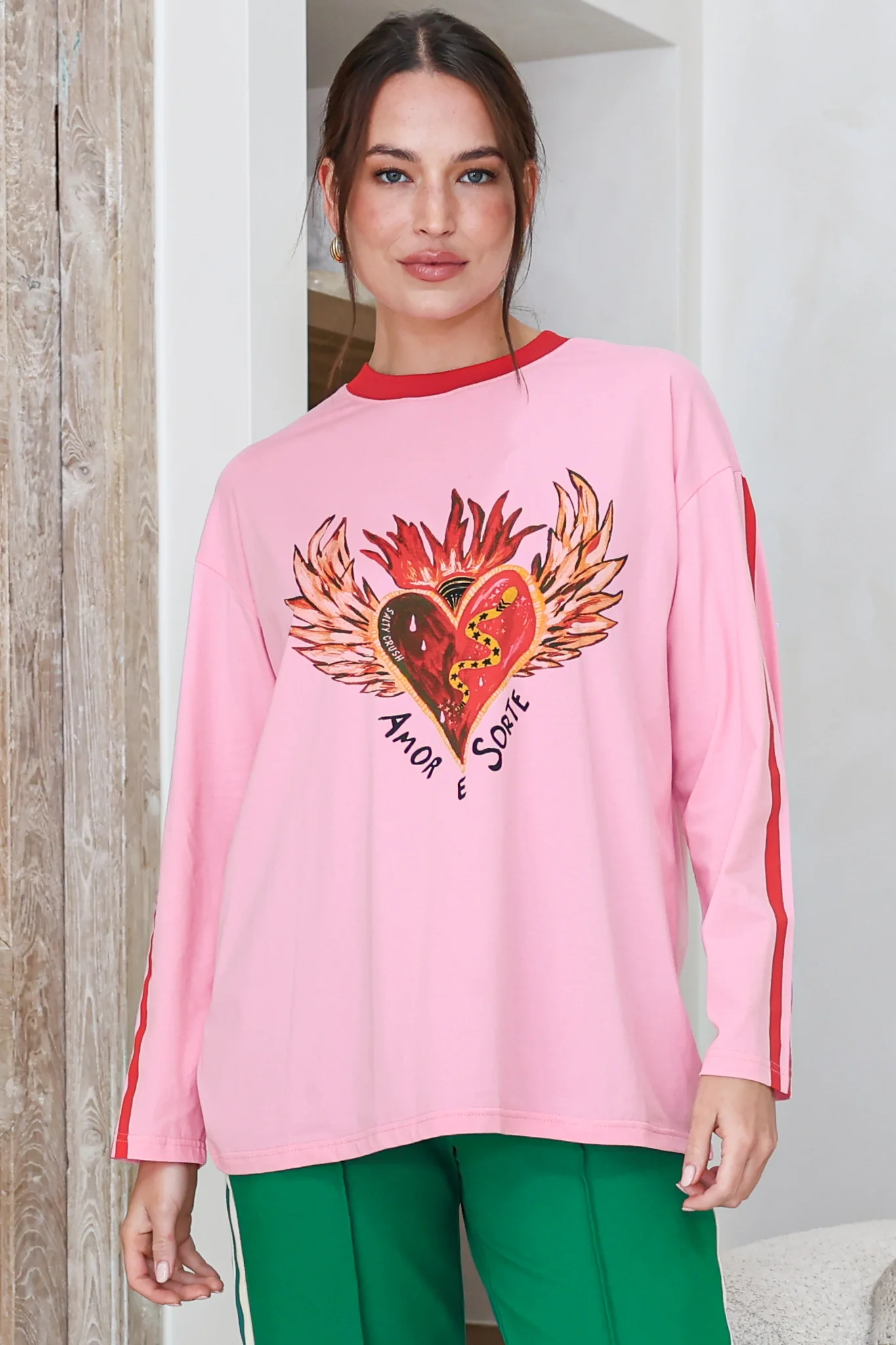 Amor E Sorte Long Sleeve Tee - Crew Neck Contrast Sport Stripe Graphic T-Shirt in Pink - Image 3