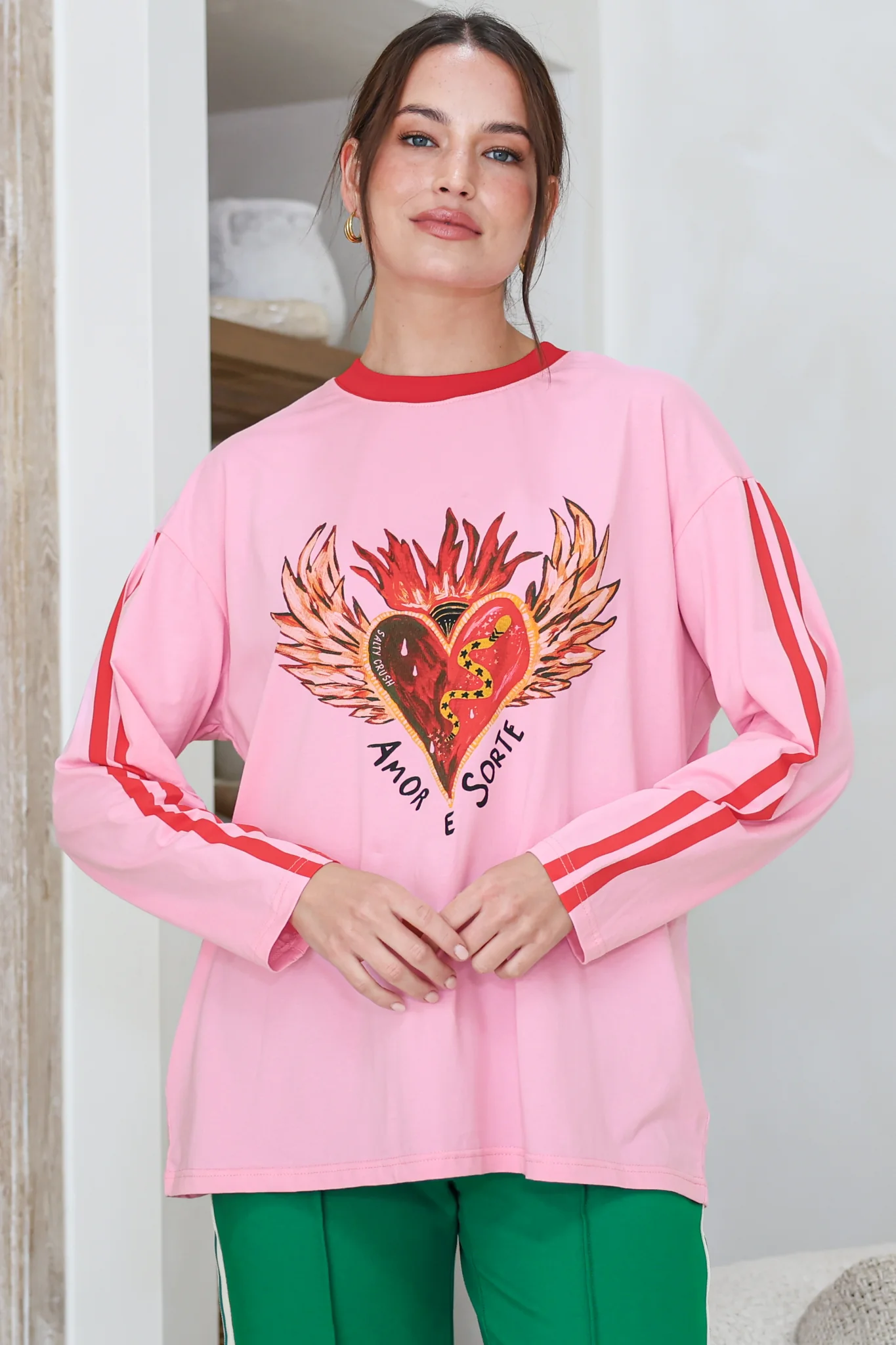 Amor E Sorte Long Sleeve Tee - Crew Neck Contrast Sport Stripe Graphic T-Shirt in Pink - Image 5