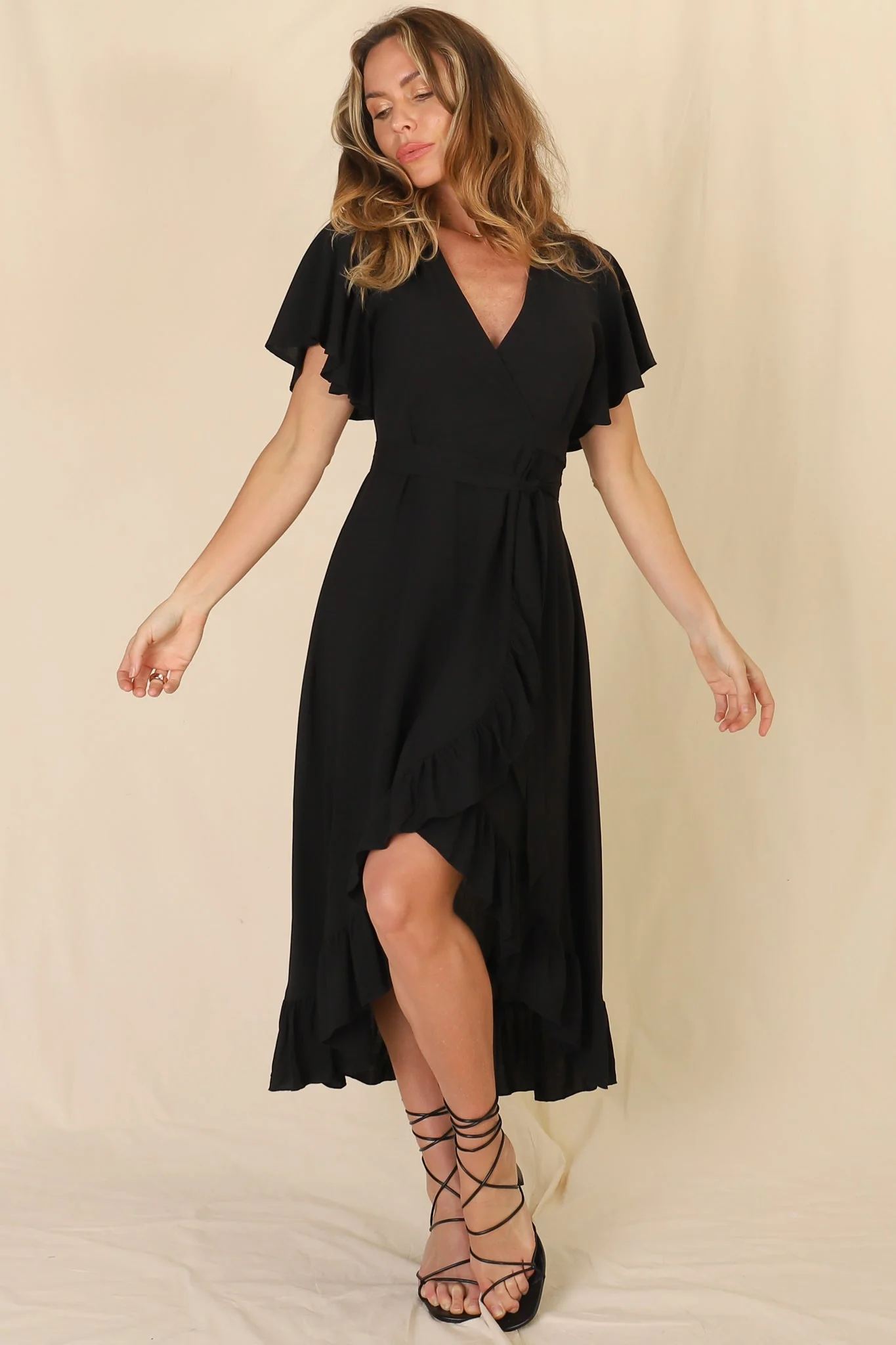 Carolina Midi Dress - V Neck Wrap Dress with Ruffle High Low Hemline in Black - Image 13