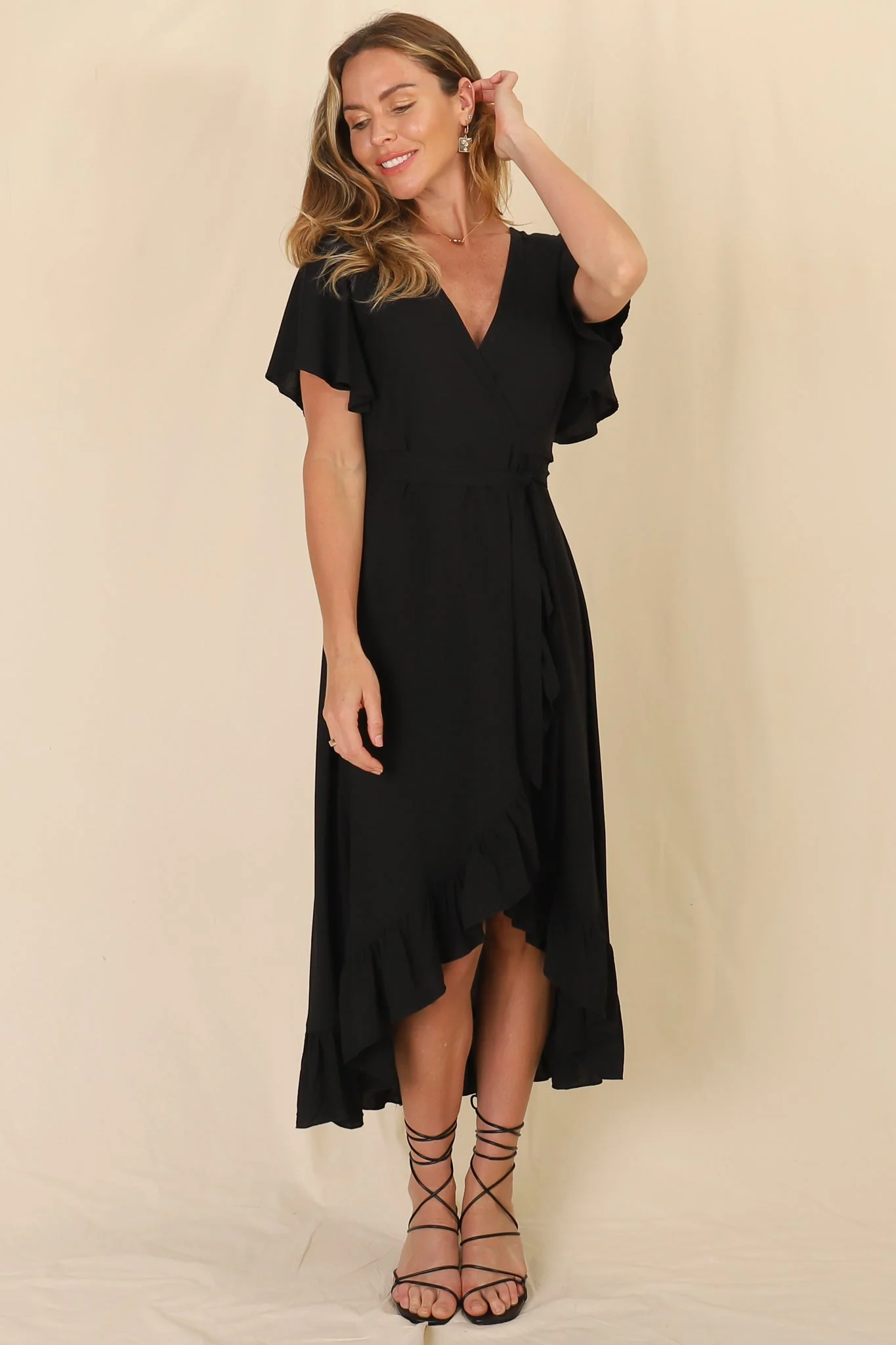 Carolina Midi Dress - V Neck Wrap Dress with Ruffle High Low Hemline in Black - Image 14