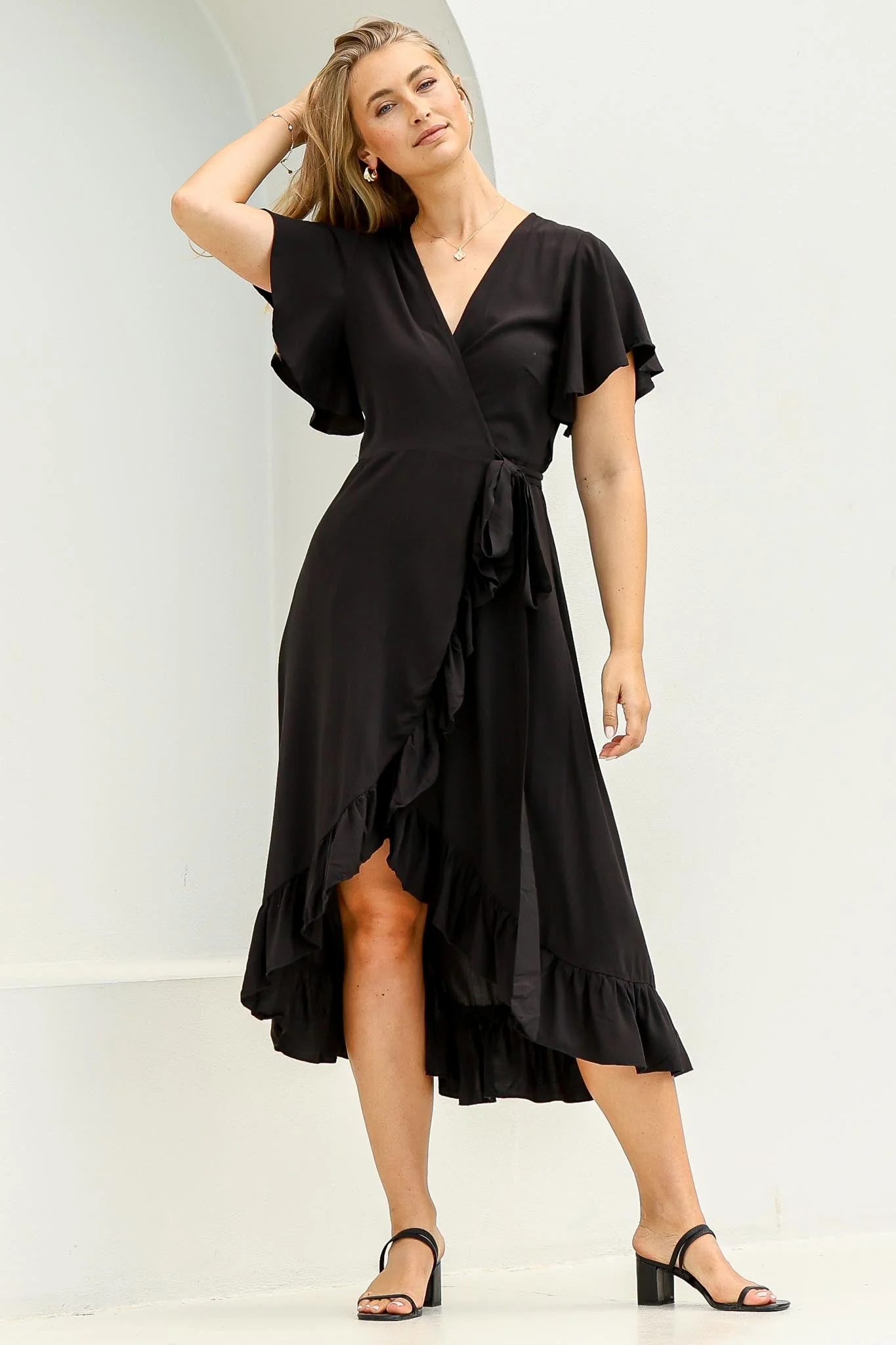 Carolina Midi Dress - V Neck Wrap Dress with Ruffle High Low Hemline in Black - Image 9