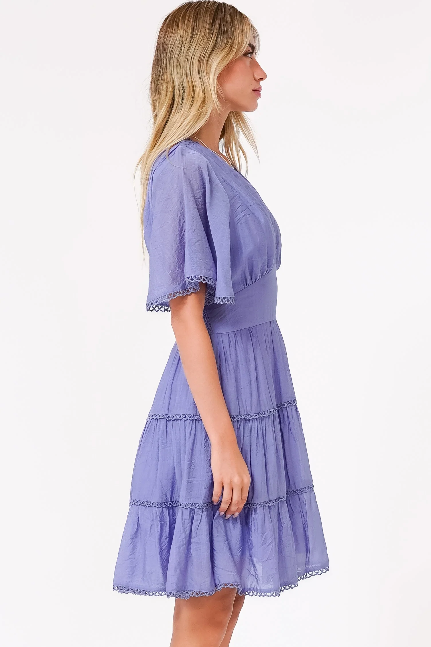 Nessie Mini Dress - Lace Trim Tiered Dress with Flutter Sleeves in Lilac - Image 7