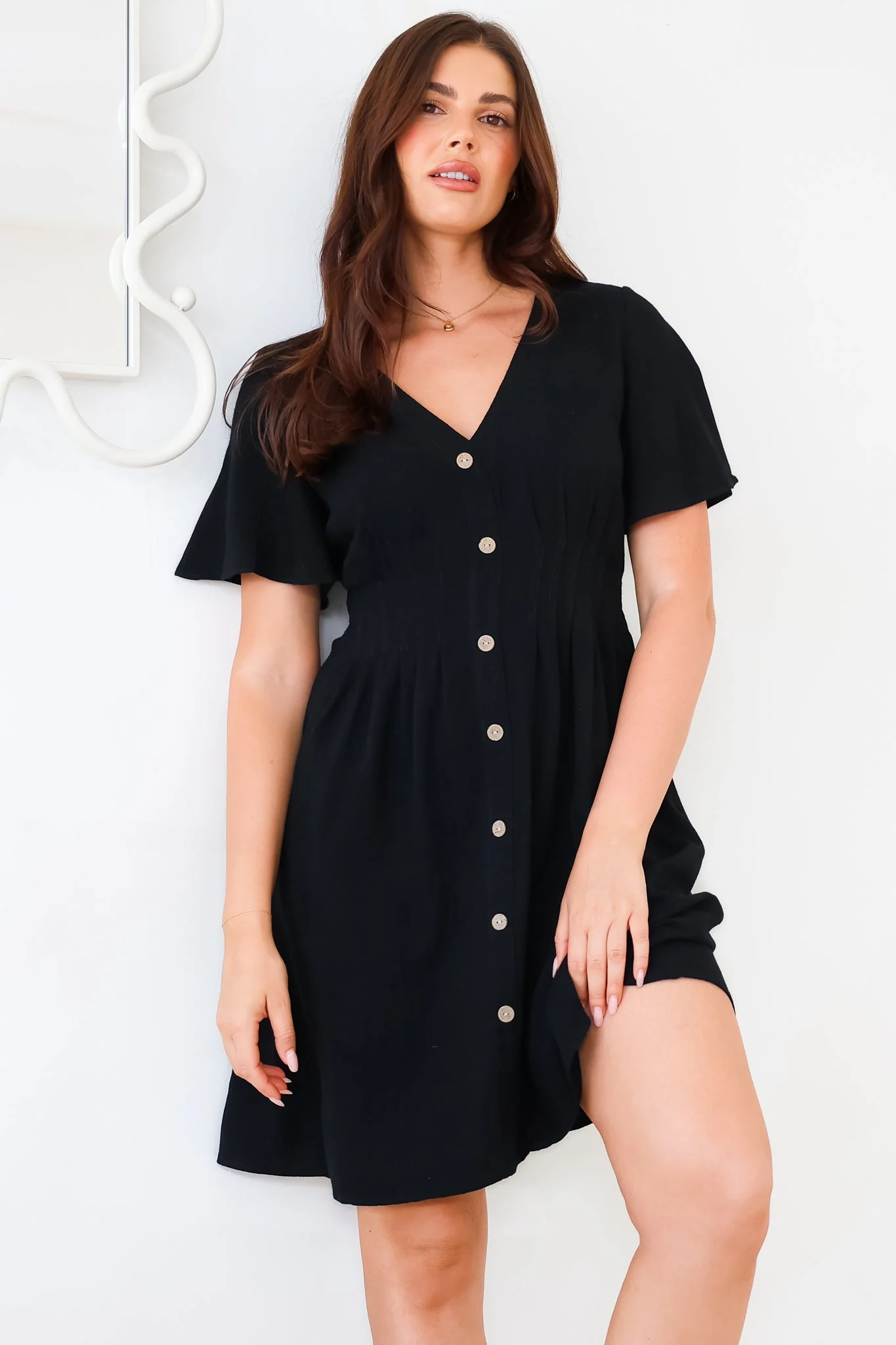 Stellar Mini Dress - Flutter Sleeve A-Line Dress with Pin Tuck Waist Detail in Black - Image 3