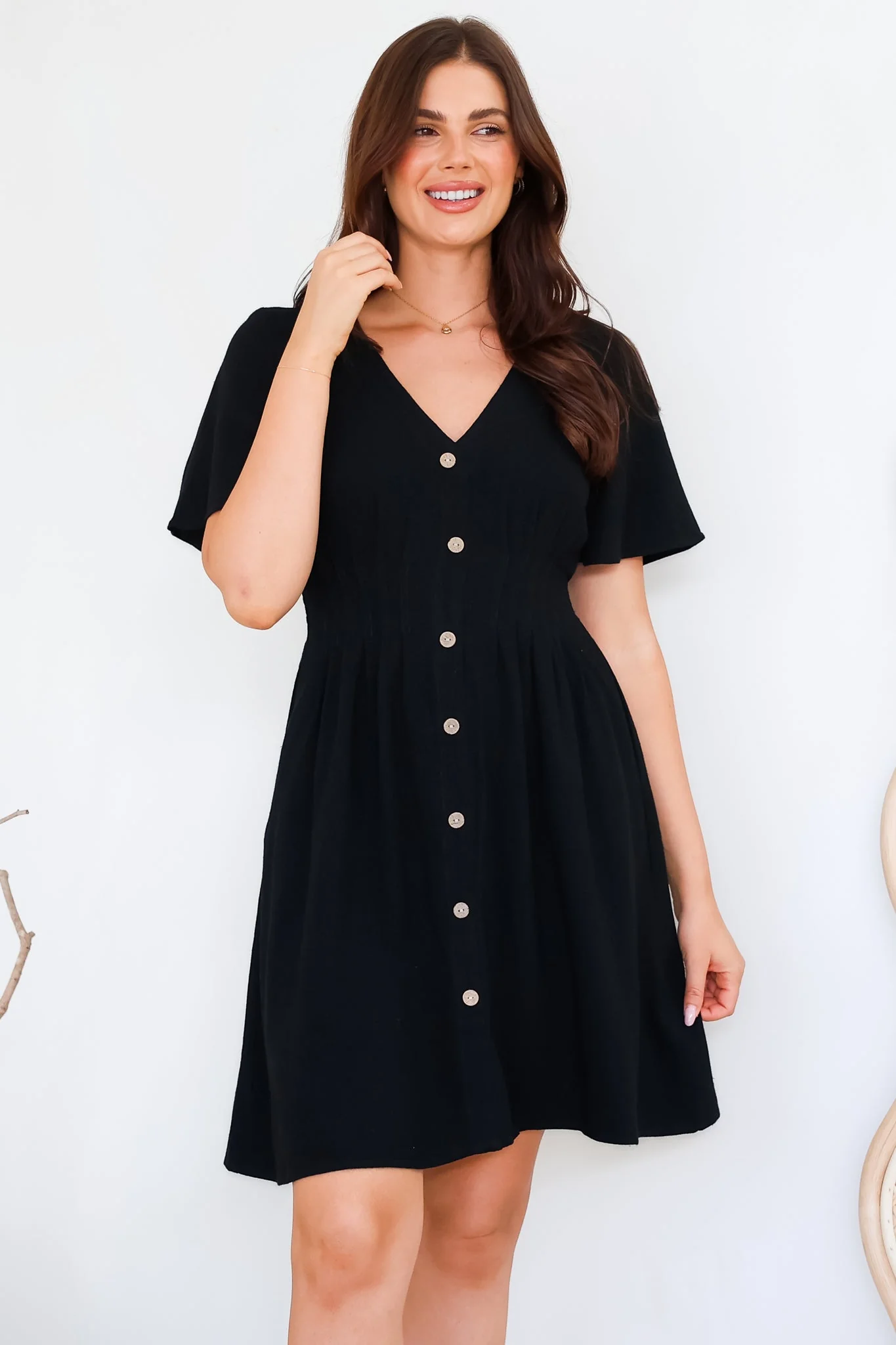 Stellar Mini Dress - Flutter Sleeve A-Line Dress with Pin Tuck Waist Detail in Black - Image 4