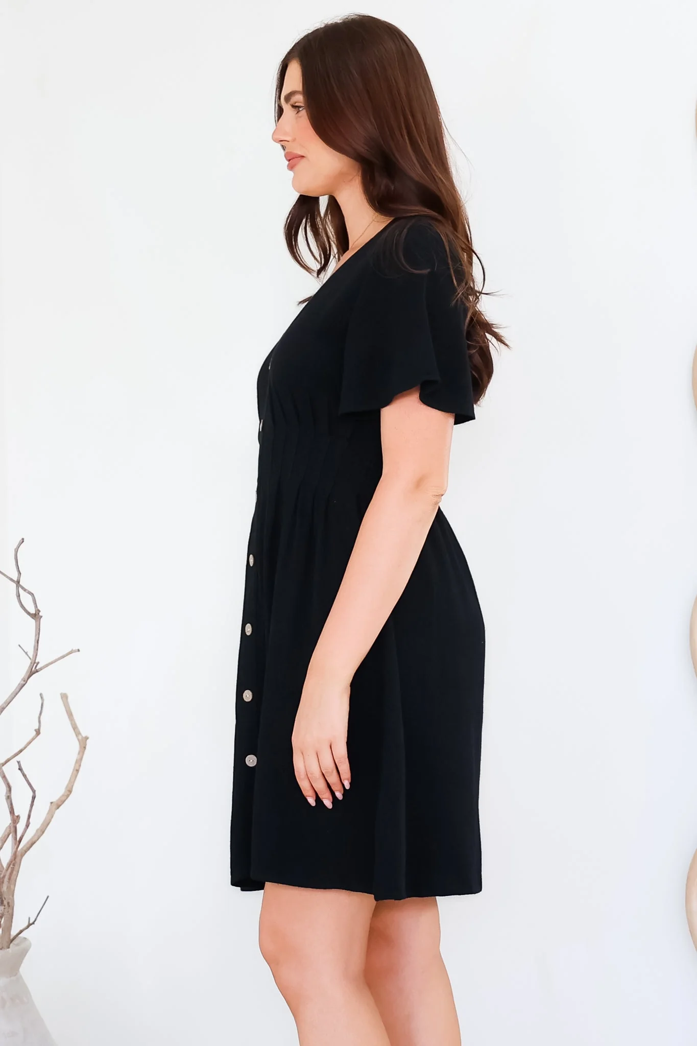 Stellar Mini Dress - Flutter Sleeve A-Line Dress with Pin Tuck Waist Detail in Black - Image 6