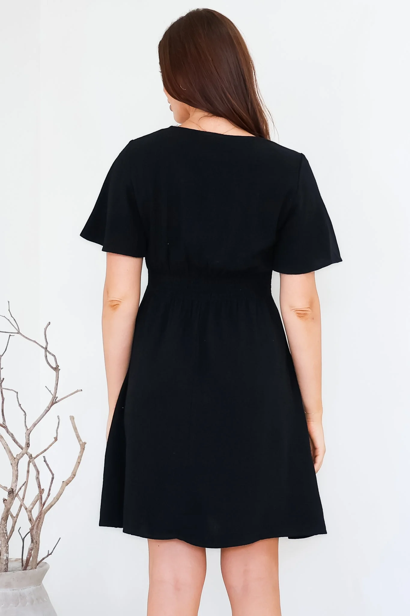 Stellar Mini Dress - Flutter Sleeve A-Line Dress with Pin Tuck Waist Detail in Black - Image 7